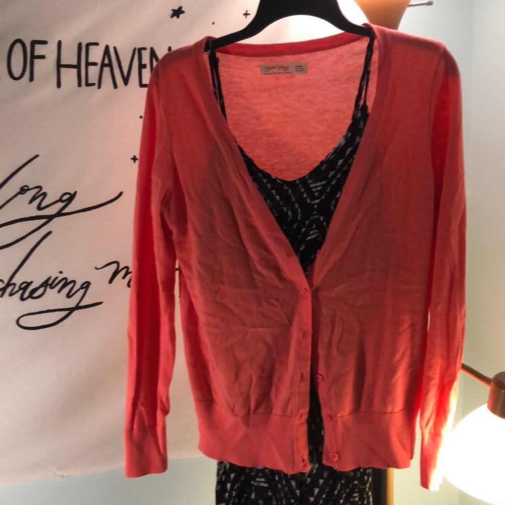 Peach cropped cardigan.